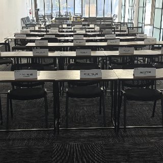 The B-OSS workshop room set with tables, name cards and chairs ready for a session
